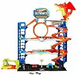 Hot Wheels City “Let's Race - ¡a Correr!” Netflix - Garaje definitivo Pista para Coches de Juguete con dragón y 4 Niveles, Incluye 2 vehículos, +4 años (Mattel HKX48)